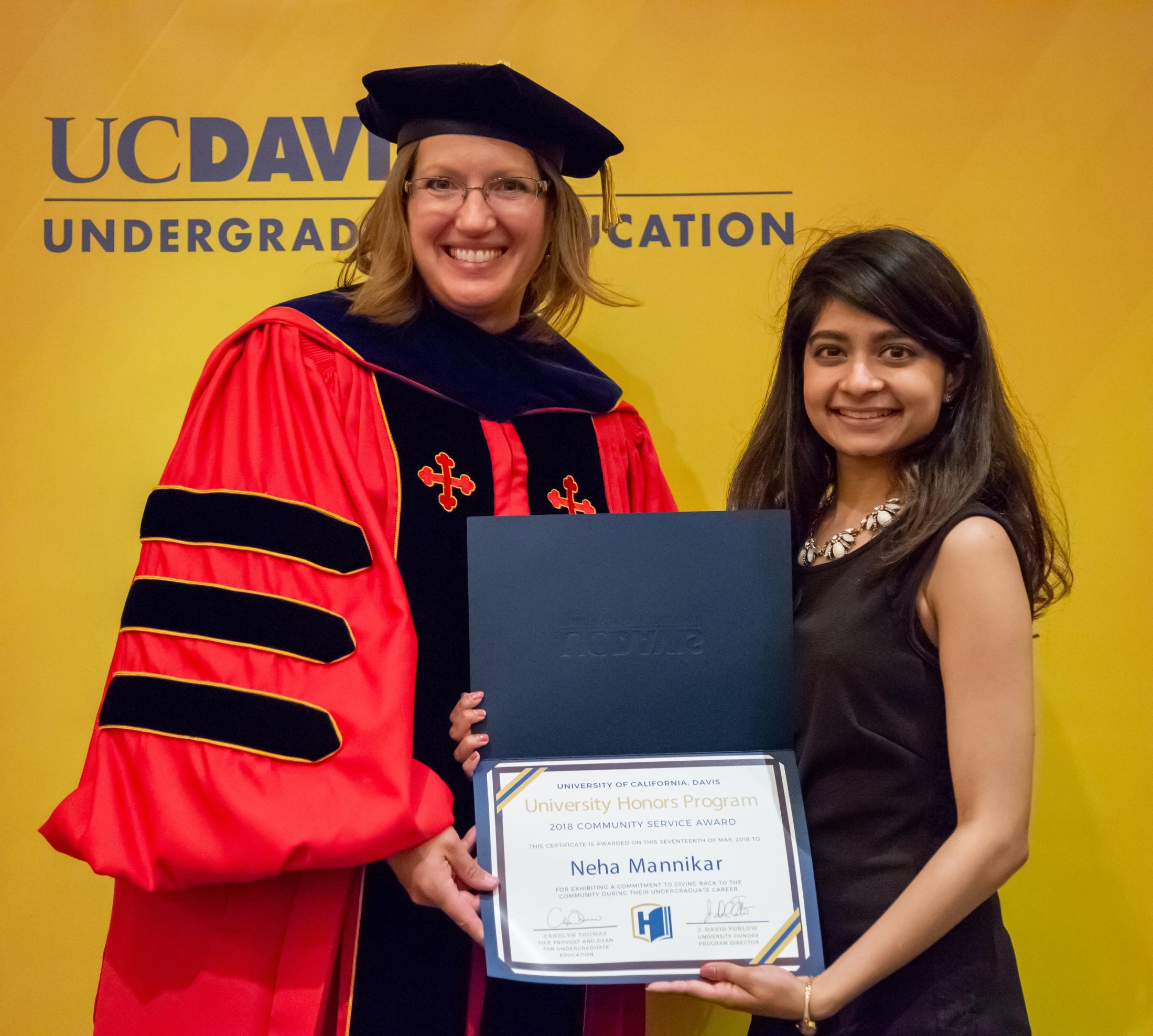 UC Davis Undergraduate Education Assistant Vice Provost Helen Schurke Frasier presents Niha Mannikar with the 2018 UHP student community service award