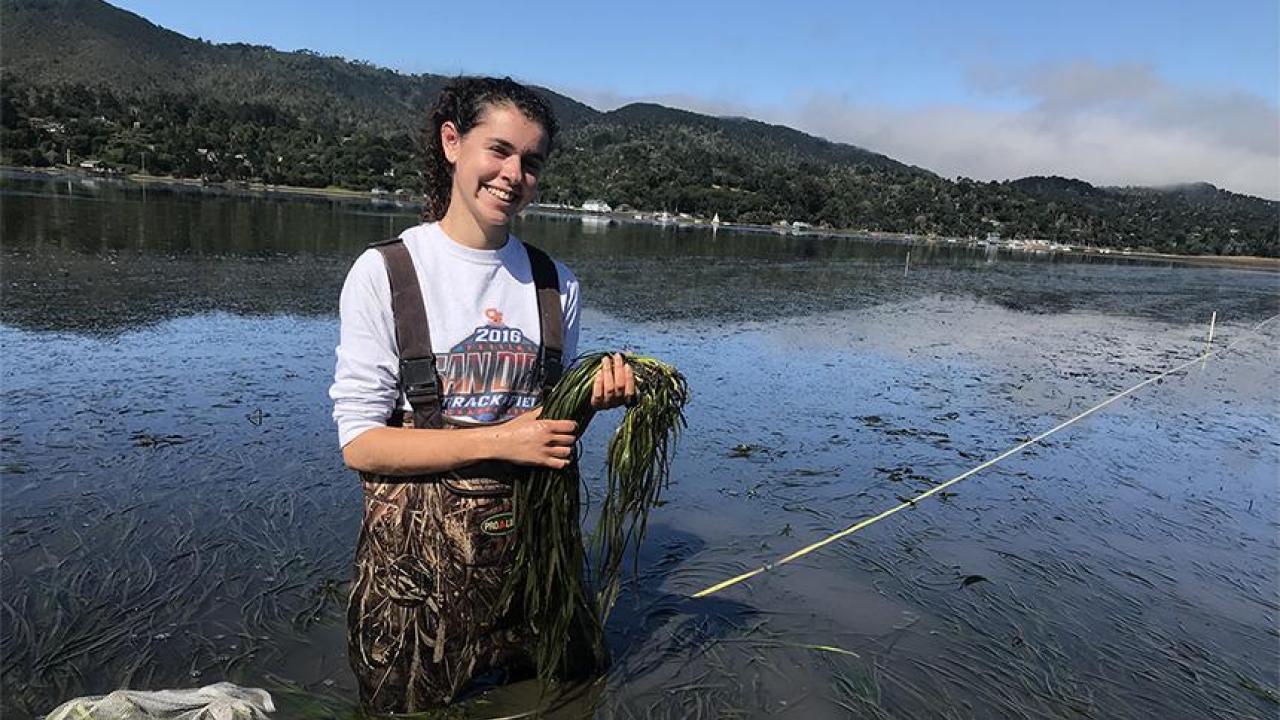 Naomi Murray holding eelgrass at Bodega Marine Lab