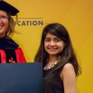 UC Davis Undergraduate Education Assistant Vice Provost Helen Schurke Frasier presents Neha Mannikar with the 2018 UHP student community service award.