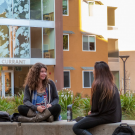 Students chatting outside of Currant Hall, the current Living Learning Community for the University Honors Program.